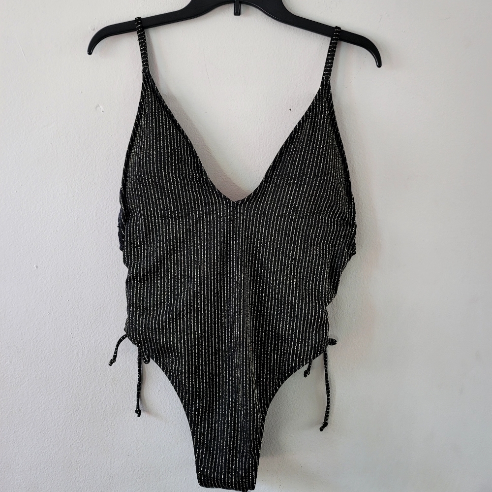 South Beach One Piece Swimsuit. Size 10, New, ruched detail with tie closure